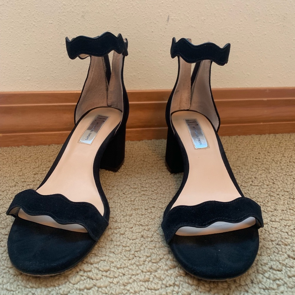 Black scalloped high heels